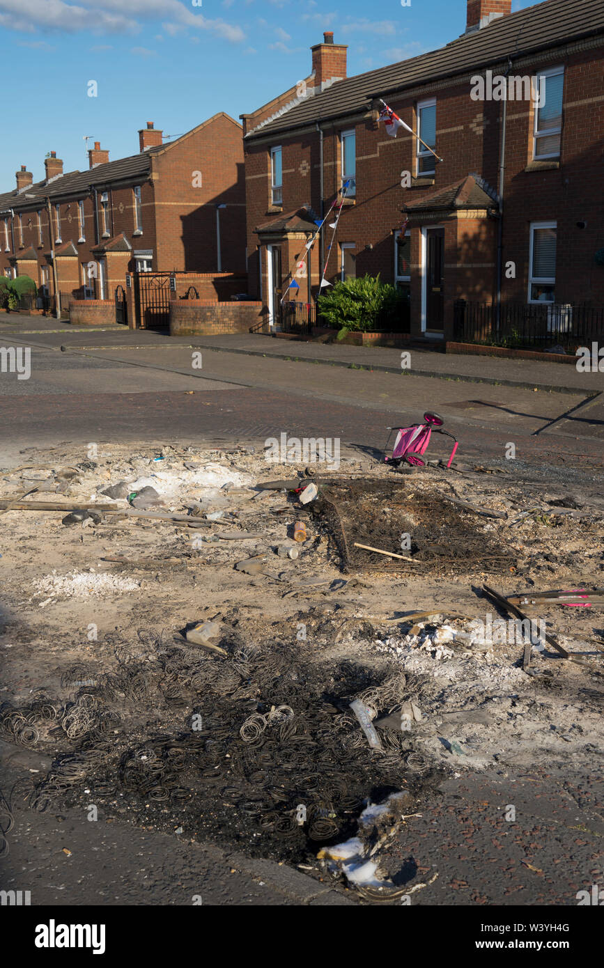 Debris in the morning after loyalist bonfire in the Shankhill area of Belfast ,Northern Ireland Stock Photo