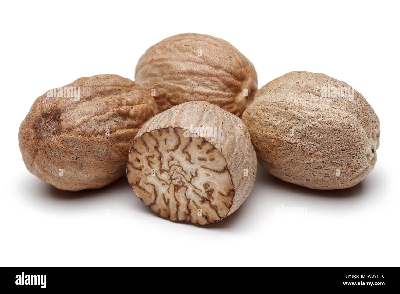 Whole and half nutmeg isolated on white background Stock Photo Alamy