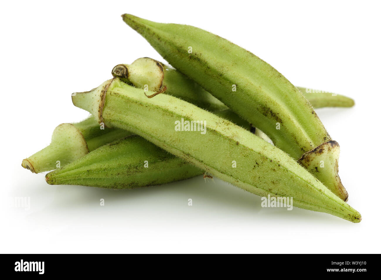 Okrow Fresh green okra isolated on white background Stock Photo - Alamy