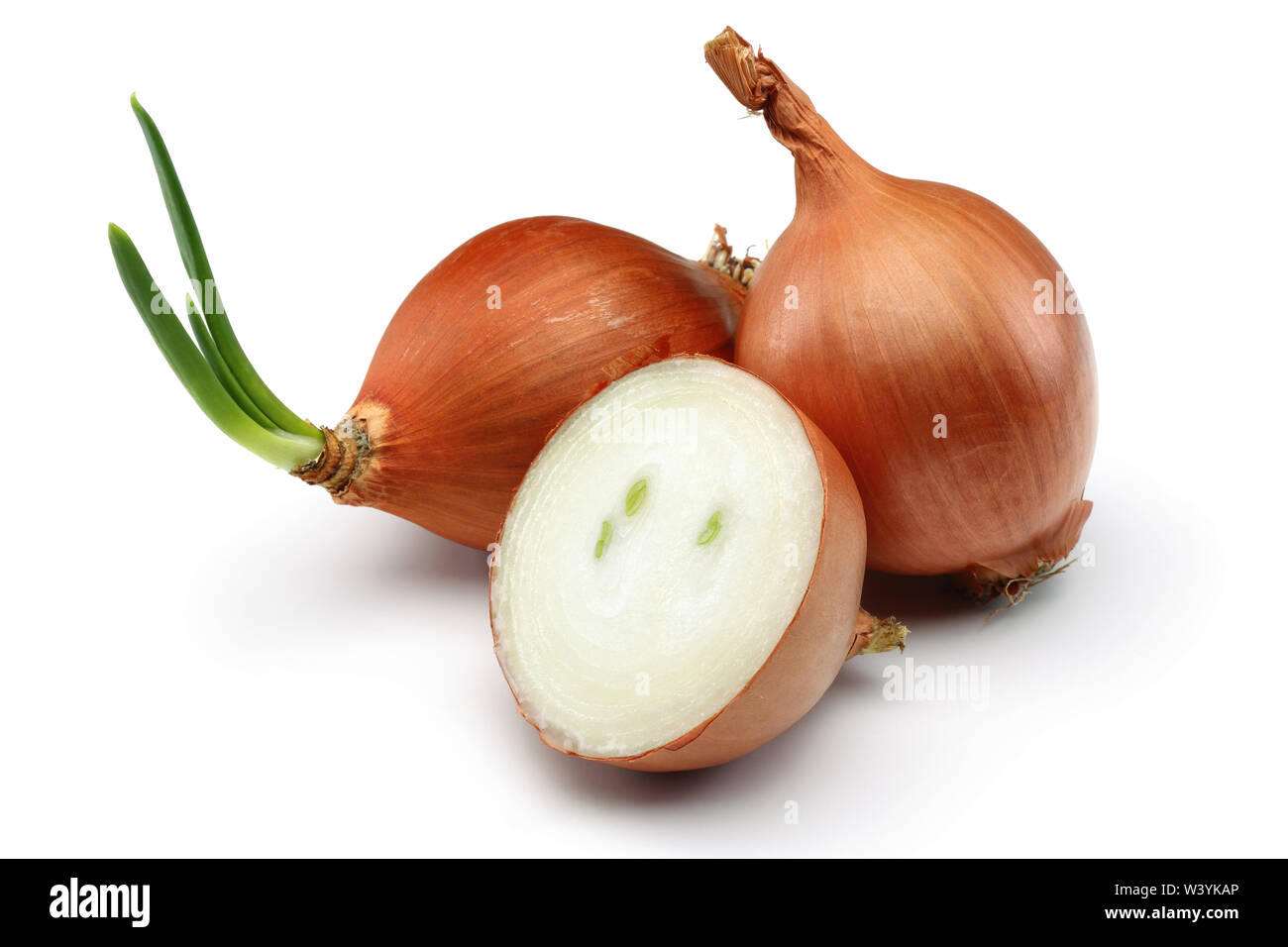 Whole and half onions isolated on background Stock Photo