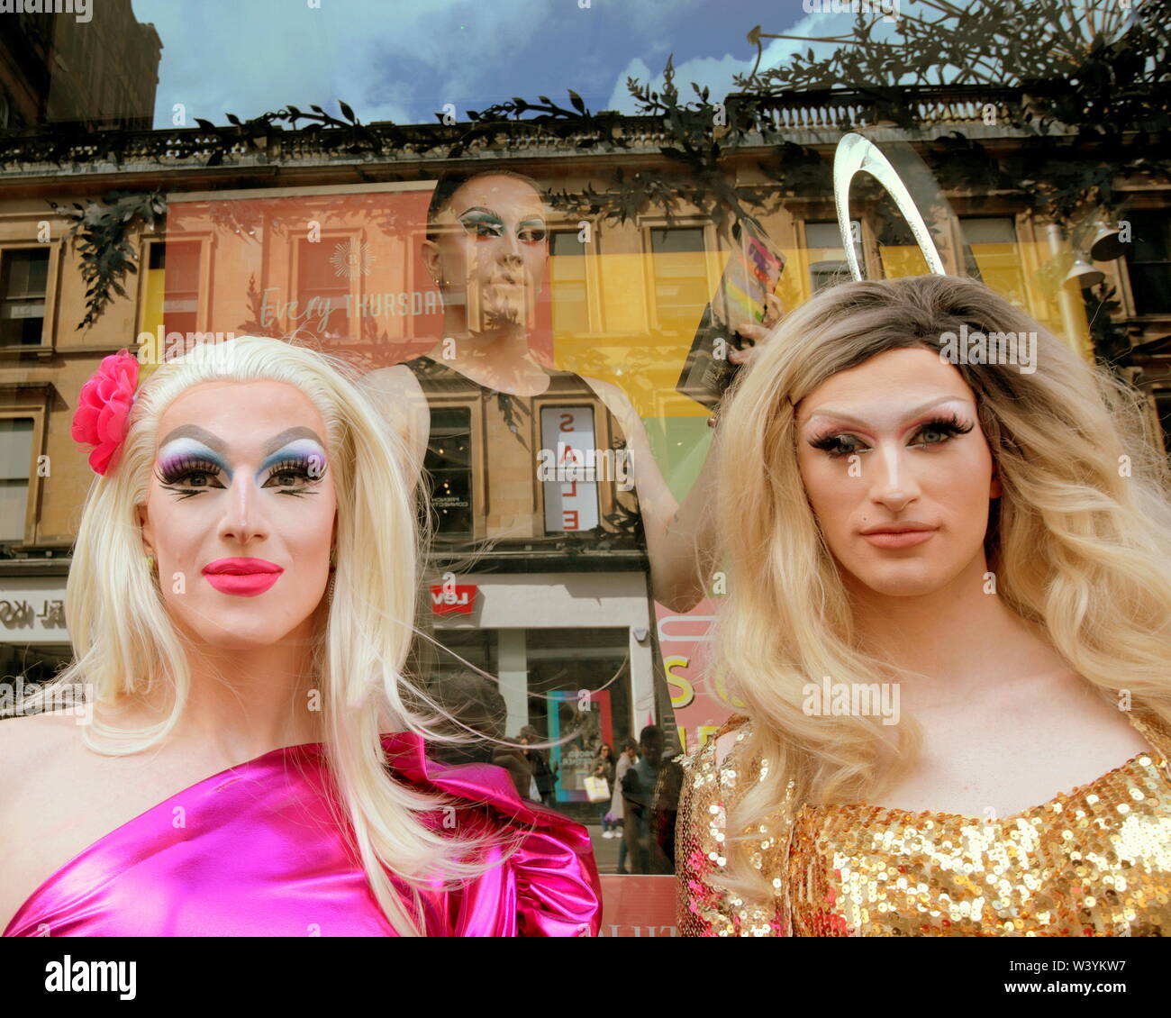 Glasgow, Scotland, UK 18th July, 2019. Lawrence chaney Drag Queens on the  style mile of the city, Buchanan street, in partnership with MAC makeup at  House of Fraser distributing fruit drinks to