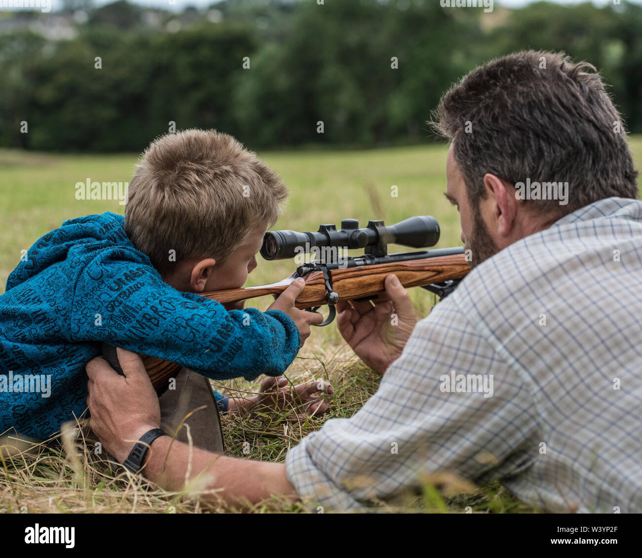 boy learning to shoot Stock Photo