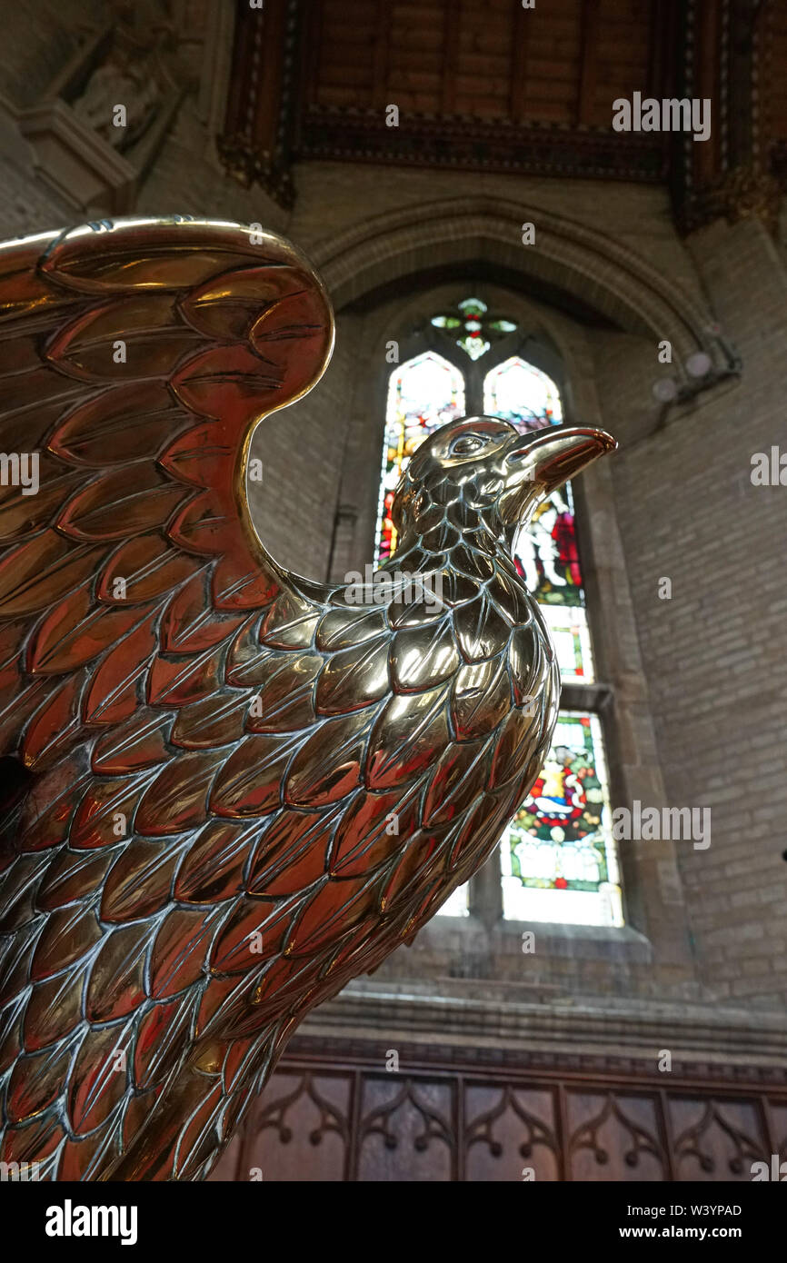 Brass eagle lecturn in a church in England Stock Photo