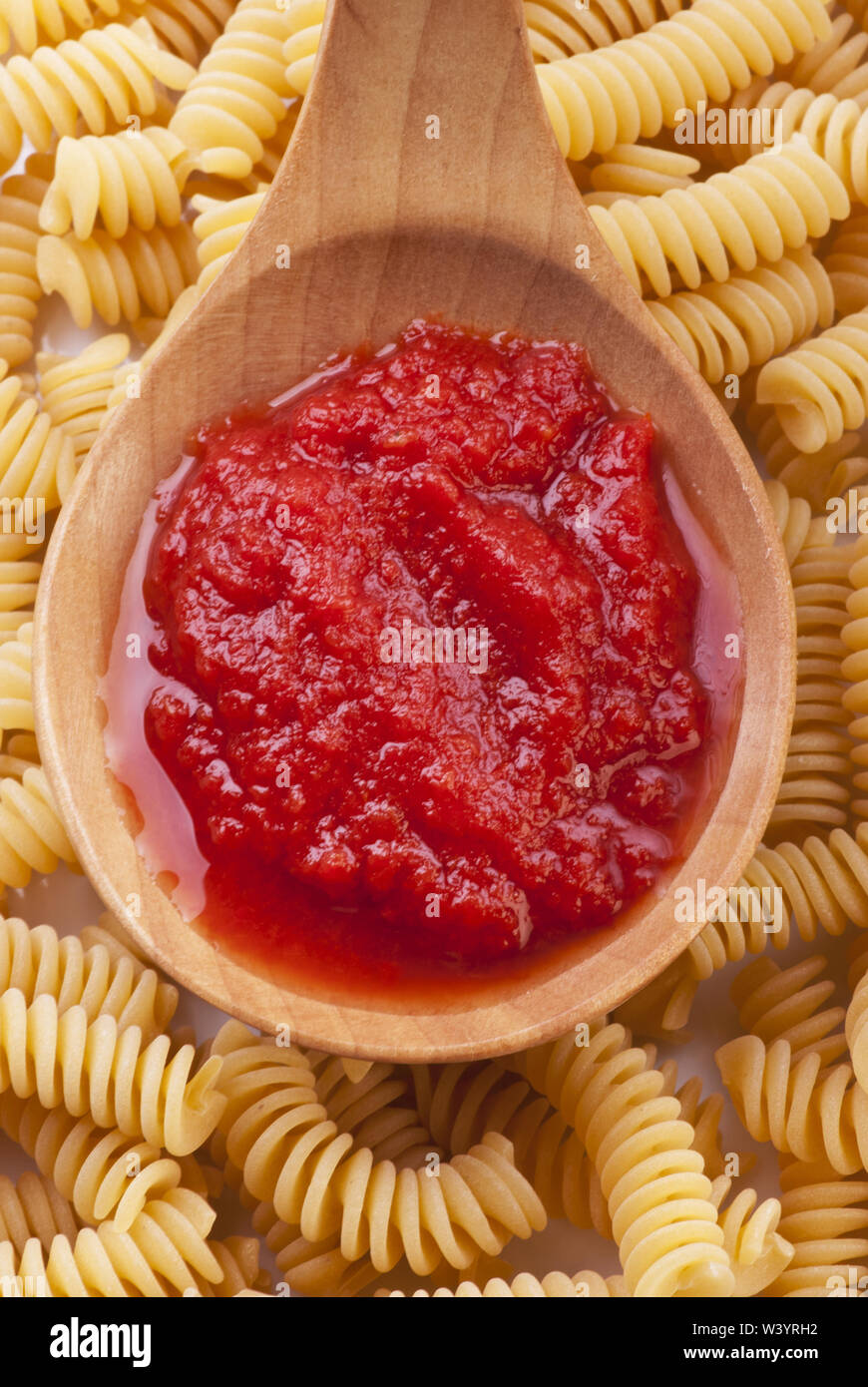 ladle full of homemade tomato sauce to season pasta Stock Photo