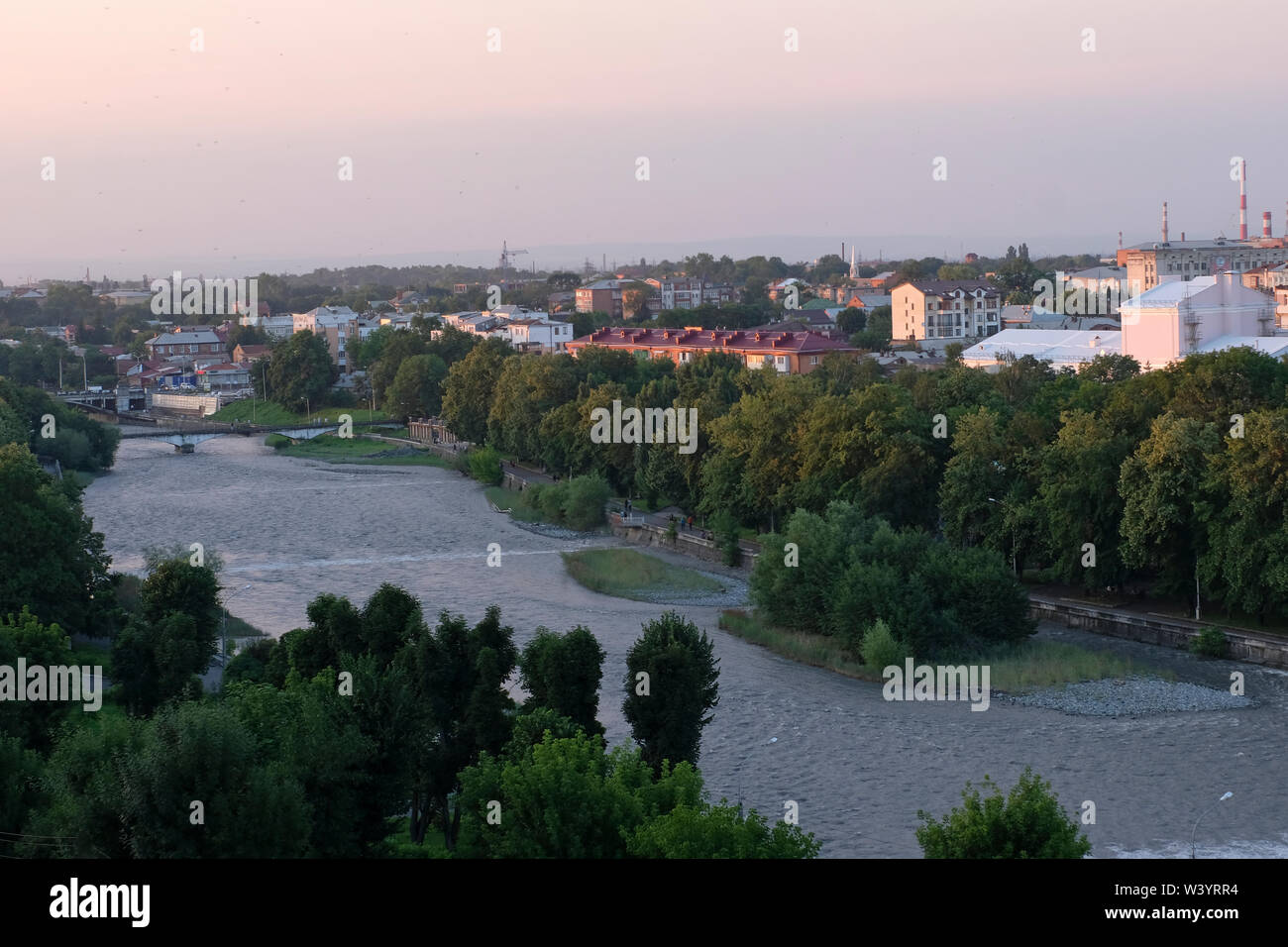 View of Terek river flowing through  Vladikavkaz the capital city of the Republic of North Ossetia-Alania in the North Caucasian Federal District of Russia. Stock Photo