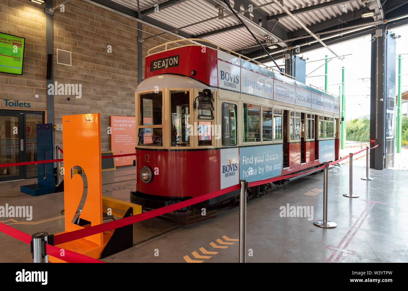 Seaton, Devon, England, UK.  Tramcar number 12 in the Seaton Tramway Station, the car was built in Eastbourne and rebuilt as an open topper in 1980. U Stock Photo