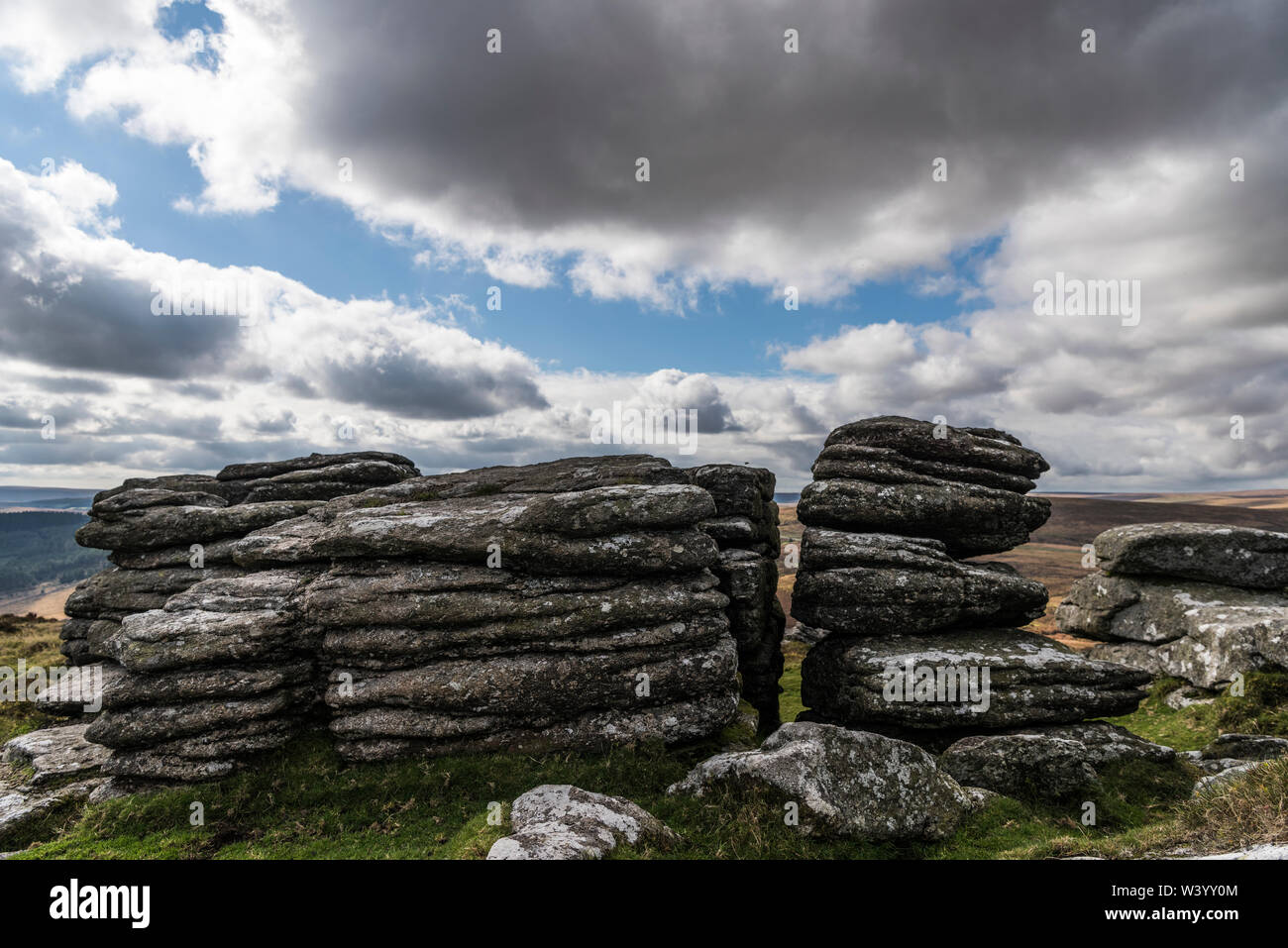Granite tor on Dartmoor national park, moody, cloudy sky, landscape Stock Photo