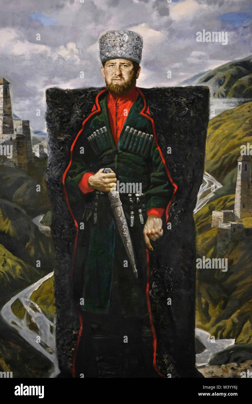 An oil painting bearing the image of  Ramzan Kadyrov the Head of the Chechen Republic in tribal clothes with an intimidating glare displayed at Akhmat Kadyrov museum overwhelmingly a shrine to Akhmat and Ramzan Kadyrov in Grozny the capital city of Chechnya in the North Caucasian Federal District of Russia. Stock Photo