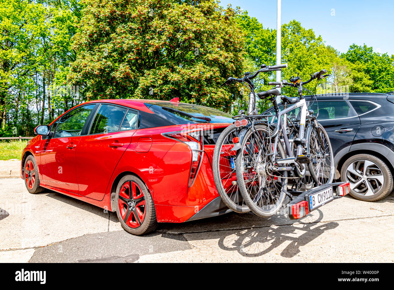 Highway 24 between Berlin and Hamburg, Germany - May 19, 2019: Red Toyota  Prius Hybrid with a cycle carrier and two pedelecs on a highway picnic area  Stock Photo - Alamy