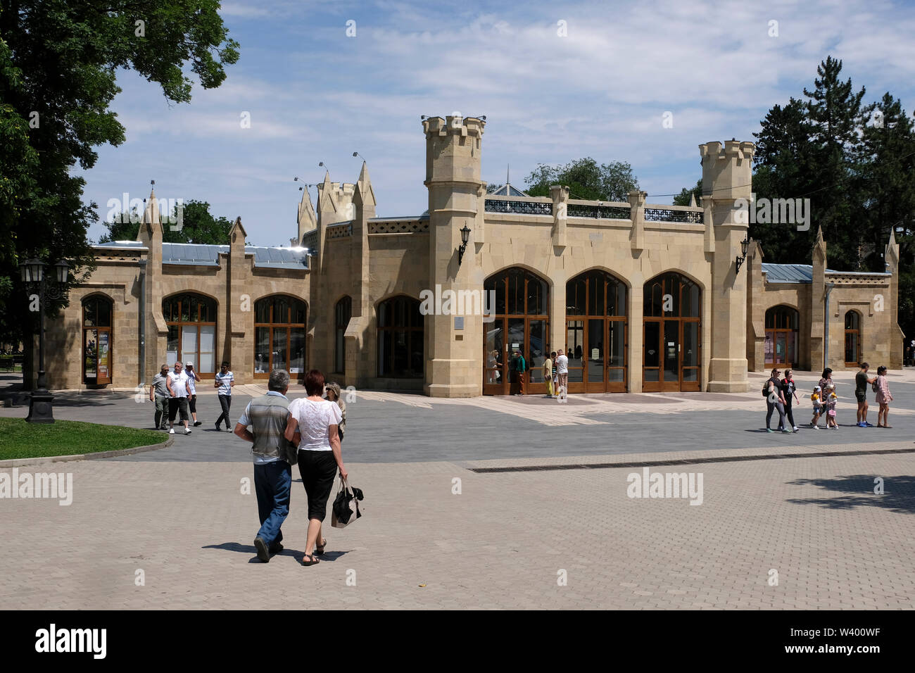 Pedestrians walk past Narzan mineral water gallery in the center of Kislovodsk a spa city in Stavropol Krai in the North Caucasian Federal District of Russia. Stock Photo