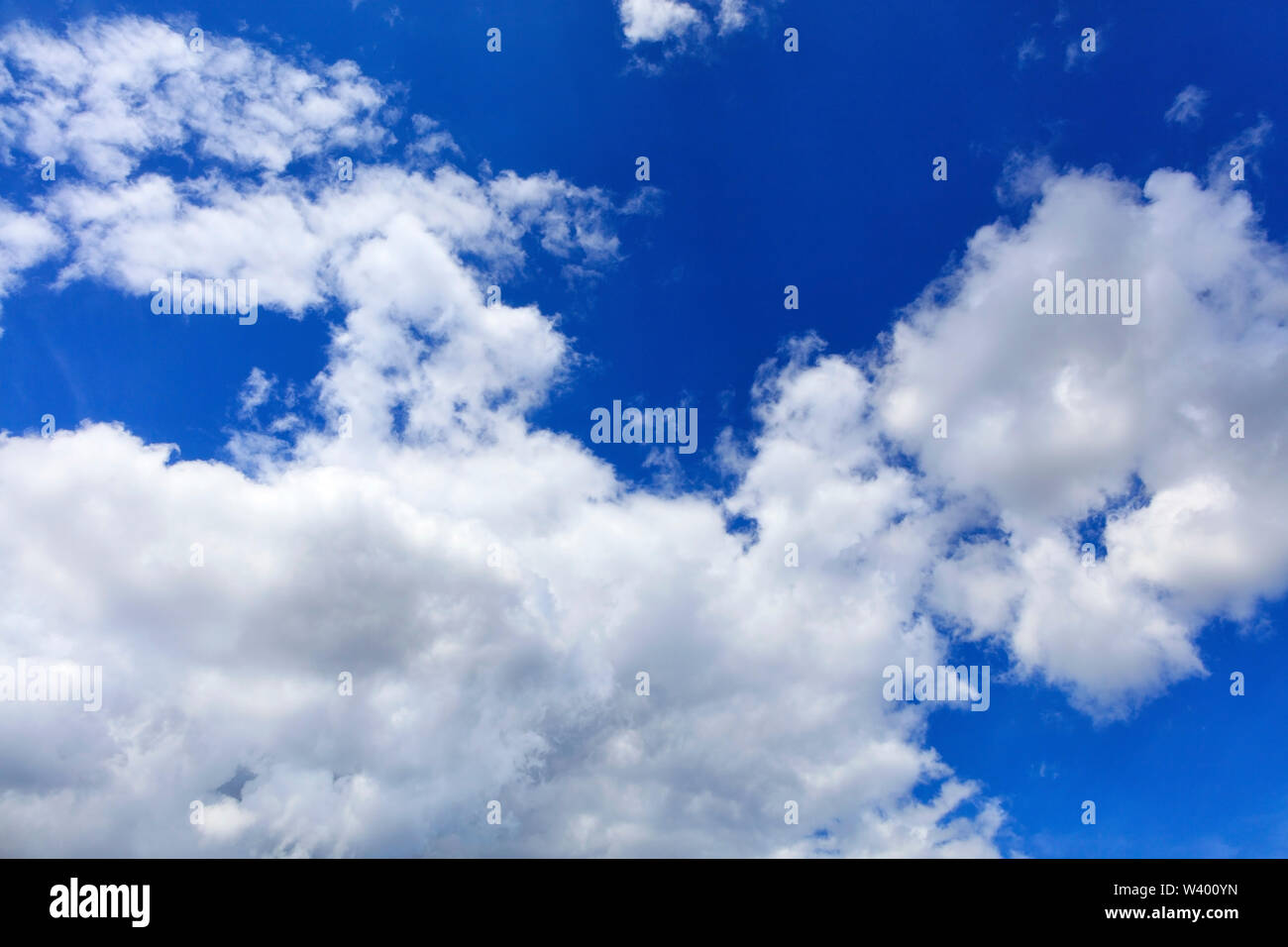 Blue sky background with white clouds texture Stock Photo - Alamy