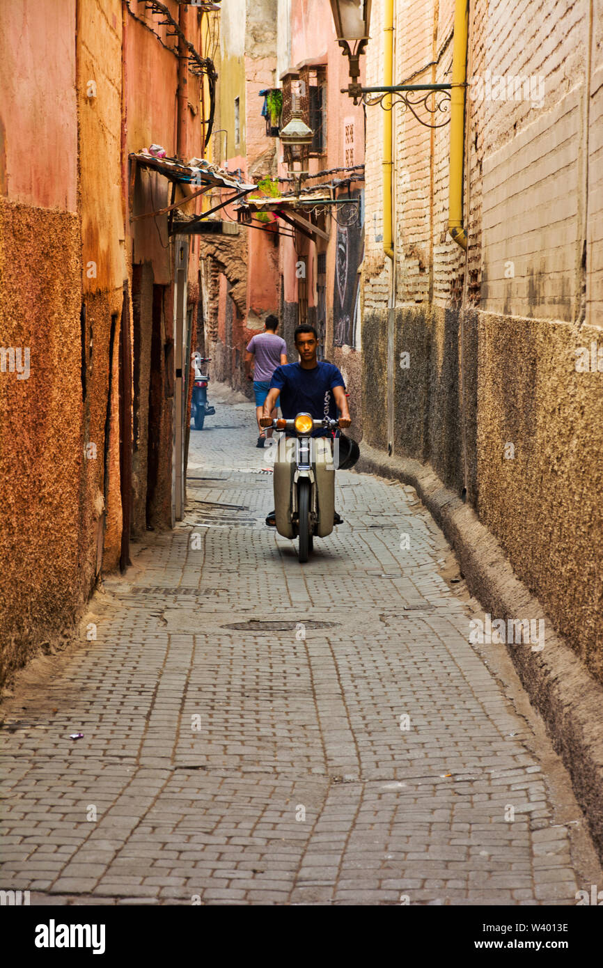 Narrow back alleyways and cobbled street scene in Marrakech, Morocco old town medina Stock Photo