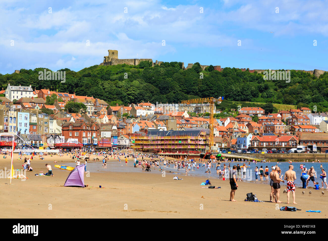 Scarborough beach and castle, South Yorkshire, England,  on a warm, sunny day. Stock Photo