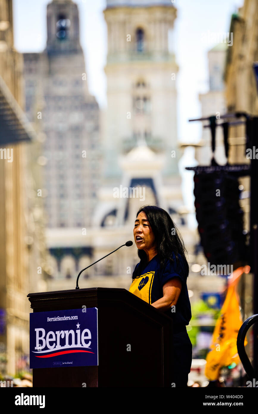 Philadelphia, Pennsylvania / USA. Philadelphia Councilwoman At-Large, Helen Gym, addresses hundreds from a podium in front of Hahnemann University Hospital in defence of health care workers. July 15, 2019. Photo Credit: Chris Baker Evens. Stock Photo