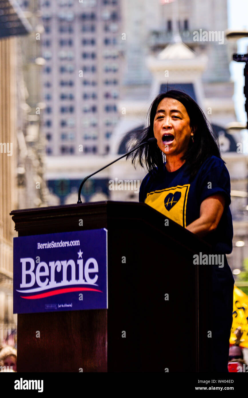 Philadelphia, Pennsylvania / USA. Philadelphia Councilwoman At-Large, Helen Gym, addresses hundreds from a podium in front of Hahnemann University Hospital in defence of health care workers. July 15, 2019. Photo Credit: Chris Baker Evens. Stock Photo