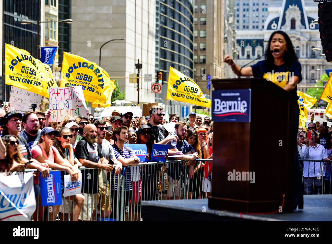 Philadelphia, Pennsylvania / USA. Philadelphia Councilwoman At-Large, Helen Gym, addresses hundreds from a podium in front of Hahnemann University Hospital in defence of health care workers. July 15, 2019. Photo Credit: Chris Baker Evens. Stock Photo
