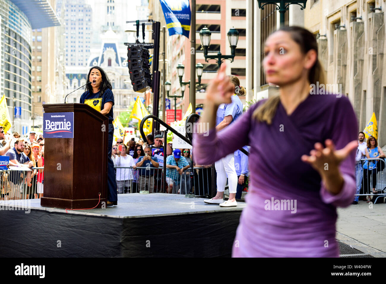 Philadelphia, Pennsylvania / USA. Philadelphia Councilwoman At-Large, Helen Gym, addresses hundreds from a podium in front of Hahnemann University Hospital in defence of health care workers. July 15, 2019. Photo Credit: Chris Baker Evens. Stock Photo