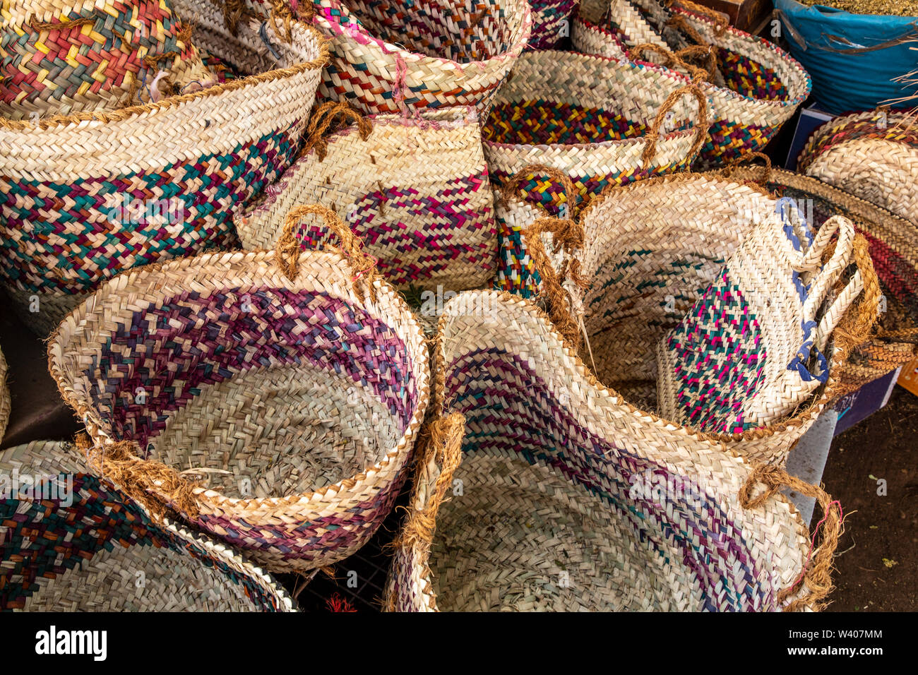 Colourful straw baskets for sale at the Temple of Isis Stock Photo Alamy
