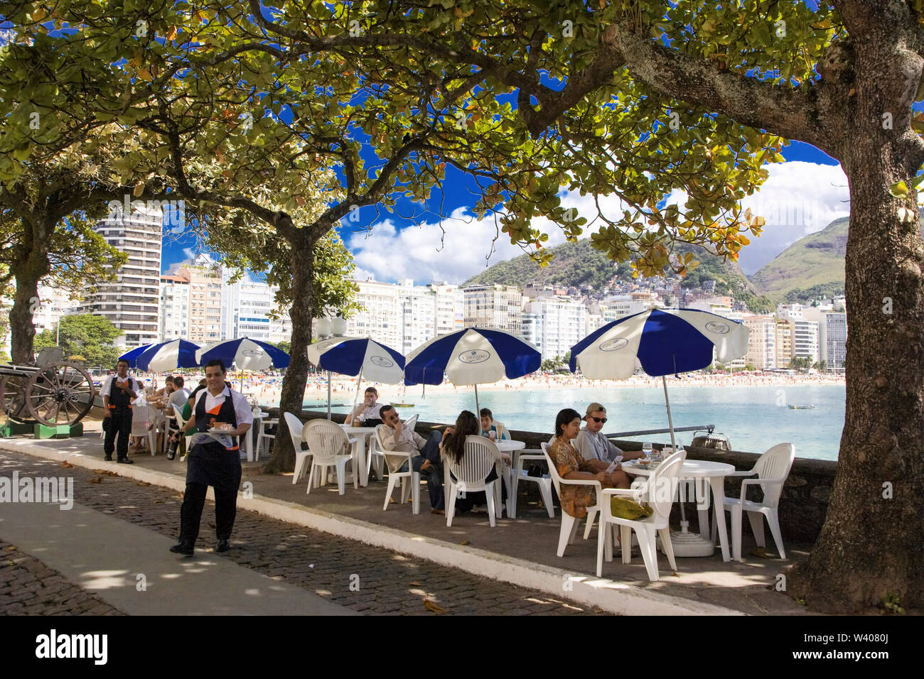 Brazil. Waiters serving drinks to people at the Colombo Cafeteria. Rio Fort  (Forte de Copacabana) Rio de Janeiro Stock Photo - Alamy