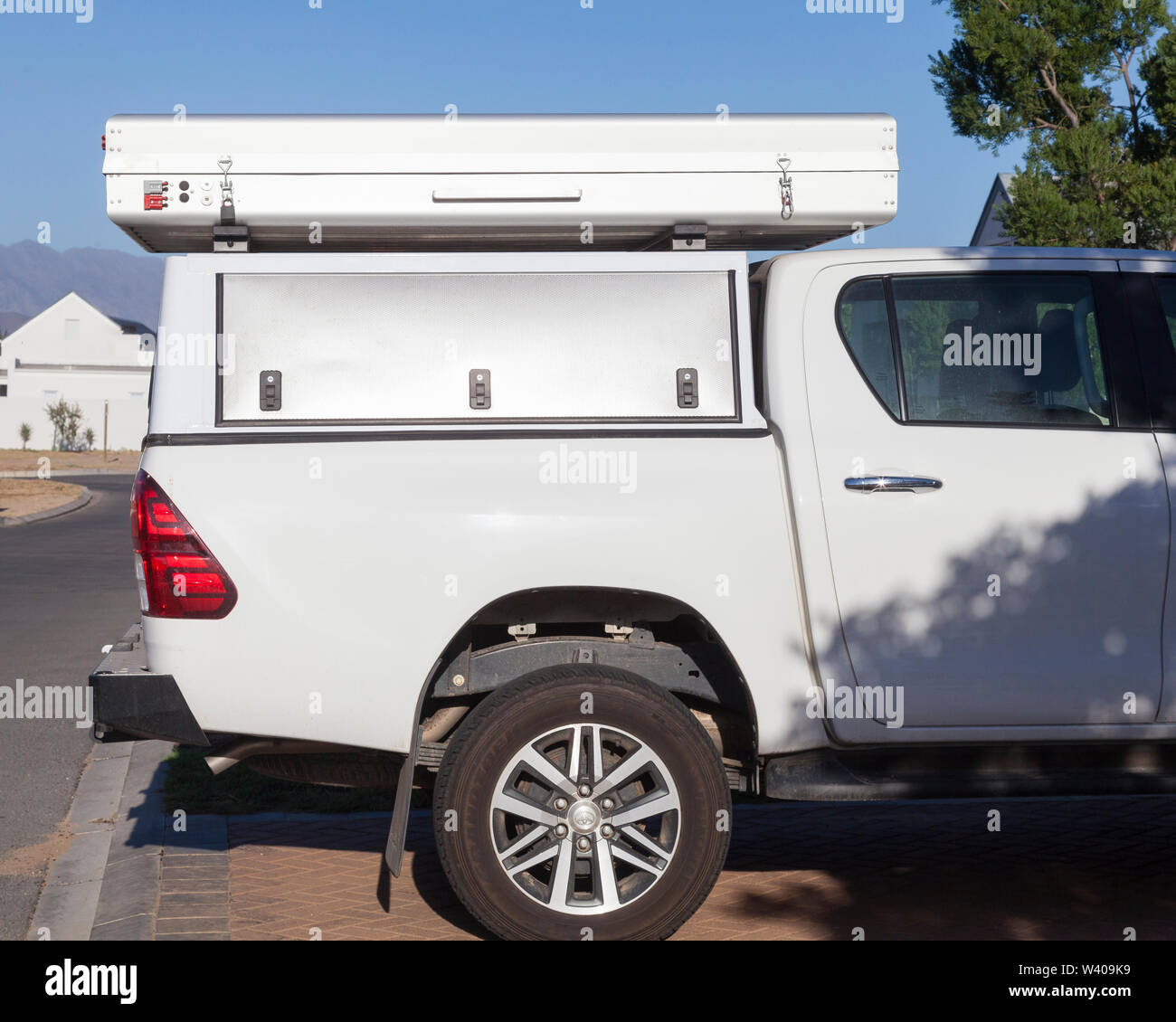 Electric Bundutop hardshell aluminium rooftop tent mounted on the canopy of  a Toyota 2.8 GD-6 Raider bakkie for 4x4 camping Stock Photo - Alamy