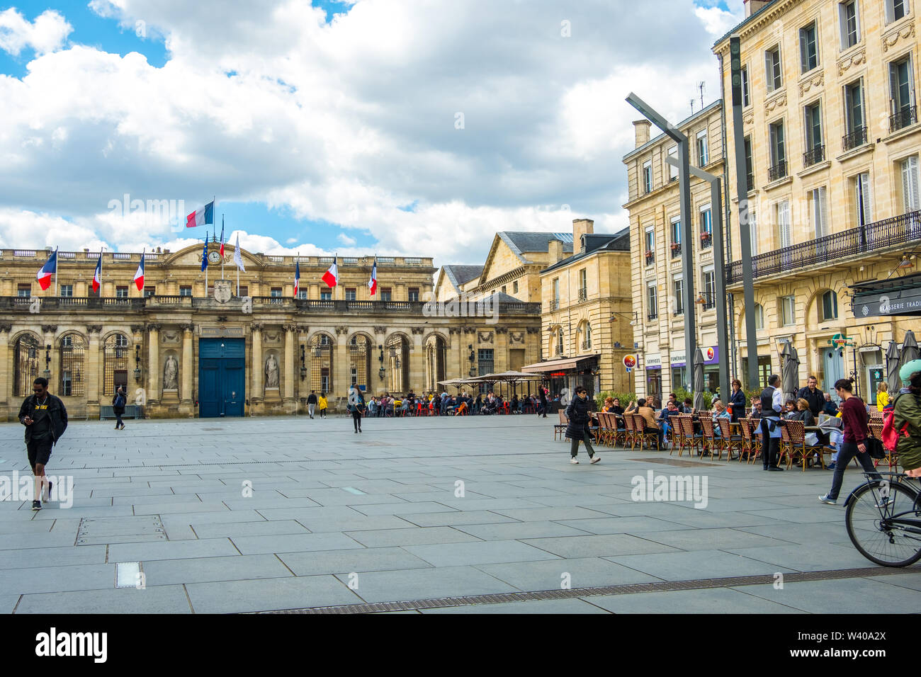Bordeaux, France - May 5, 2019 : A Place Pey Berland in front of the City Hall with street cafes where people relax. Bordeaux, Aquitaine, France Stock Photo