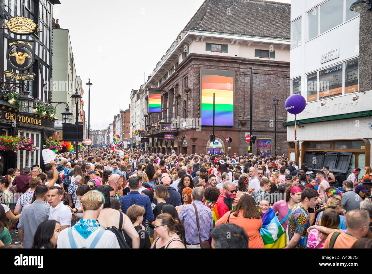 Revellers filling Old Compton Street for Pride Stock Photo
