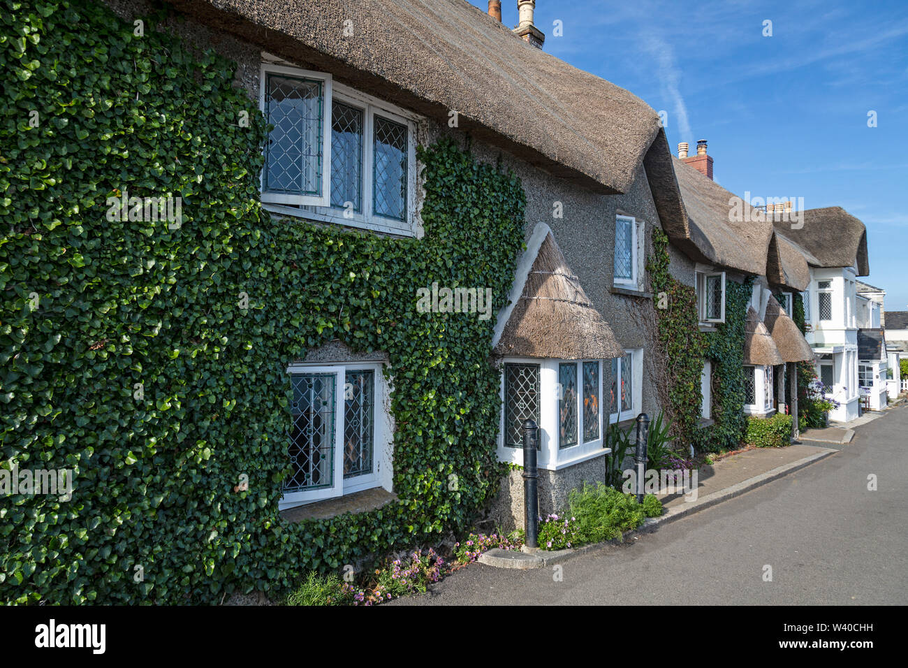 Thatched houses in the coastal village of St. Mawes in Cornwall