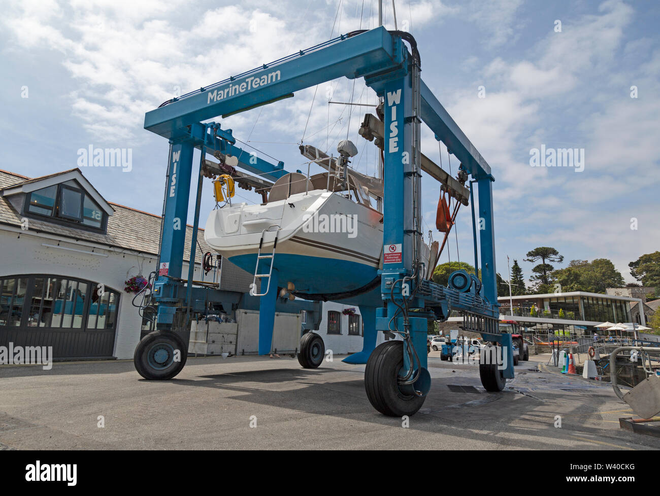 A boat, or yacht crane or hoist, removing a small yacht in Mylor
