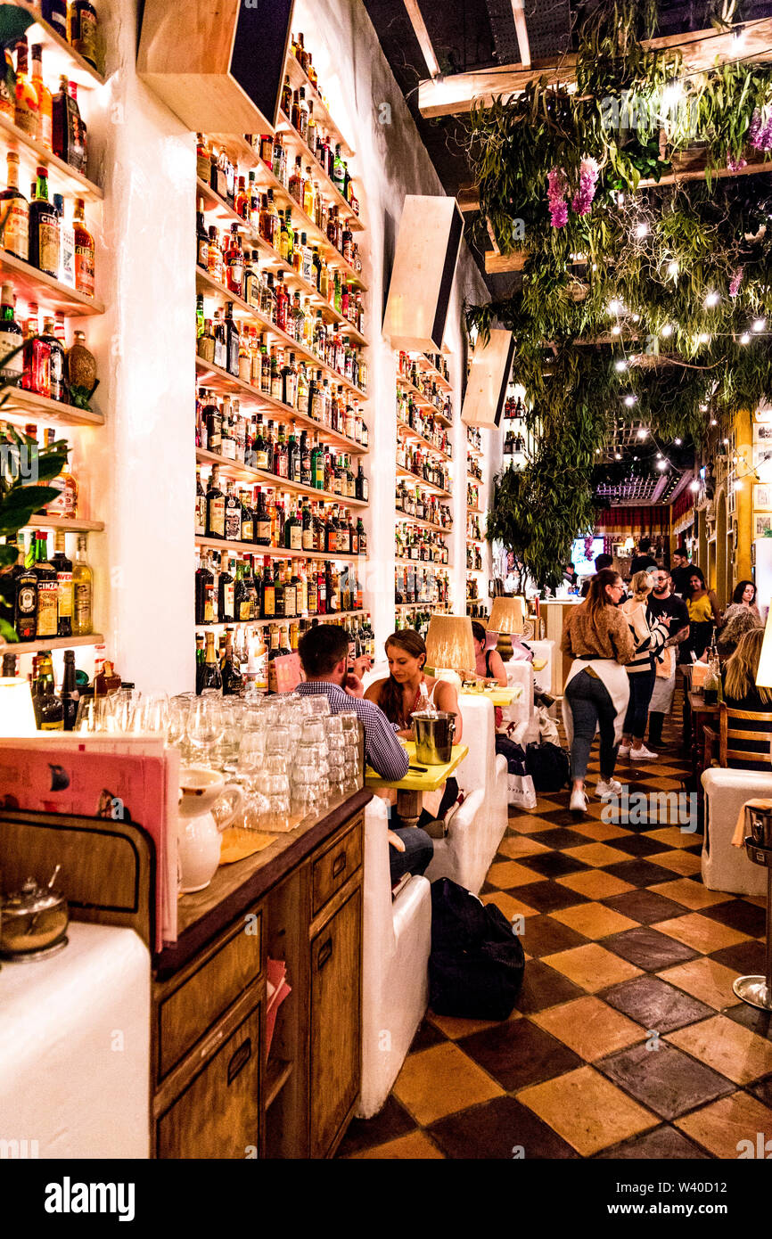 Romantic, rustic interior of Sicilian restaurant Circolo Popolare Restaurant, Rathbone Street, London, UK Stock Photo