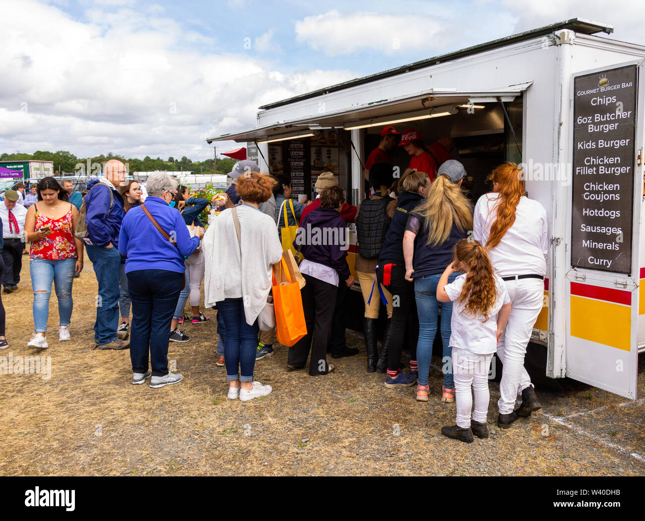queue of people at a fast food trailer Stock Photo