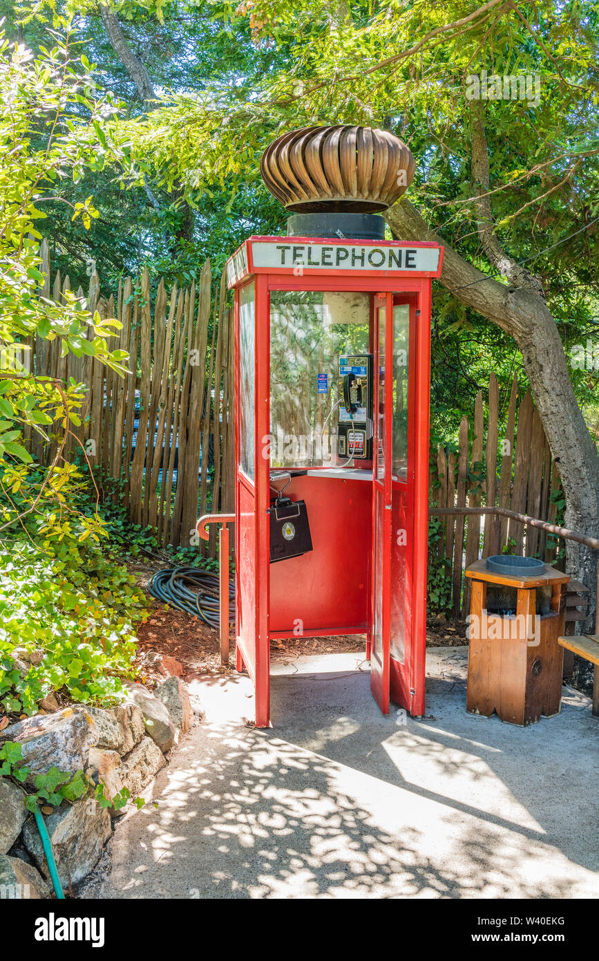 Highly unusual and humorous British Red Telephone Box with a huge turbine wind ventilator on top at Nepenthe restaurant in Big Sur, California. Stock Photo