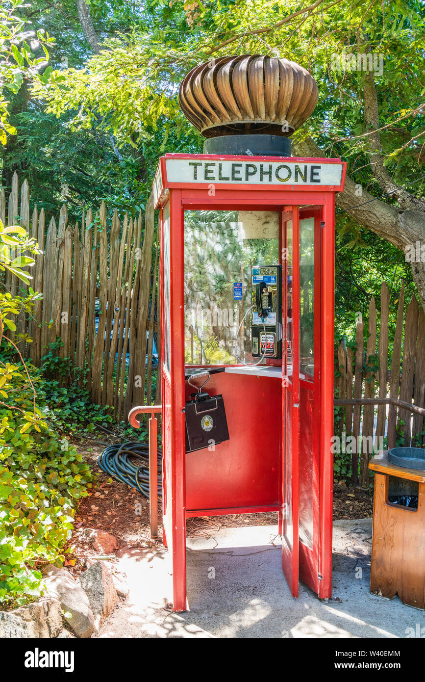 Highly unusual and humorous British Red Telephone Box with a huge turbine wind ventilator on top at Nepenthe restaurant in Big Sur, California. Stock Photo