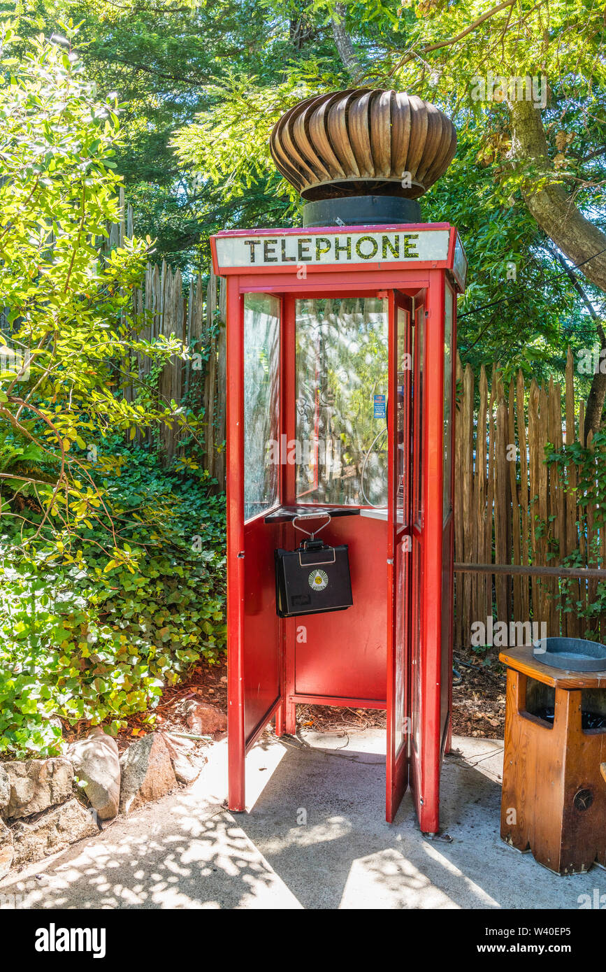 Highly unusual and humorous British Red Telephone Box with a huge turbine wind ventilator on top at Nepenthe restaurant in Big Sur, California. Stock Photo