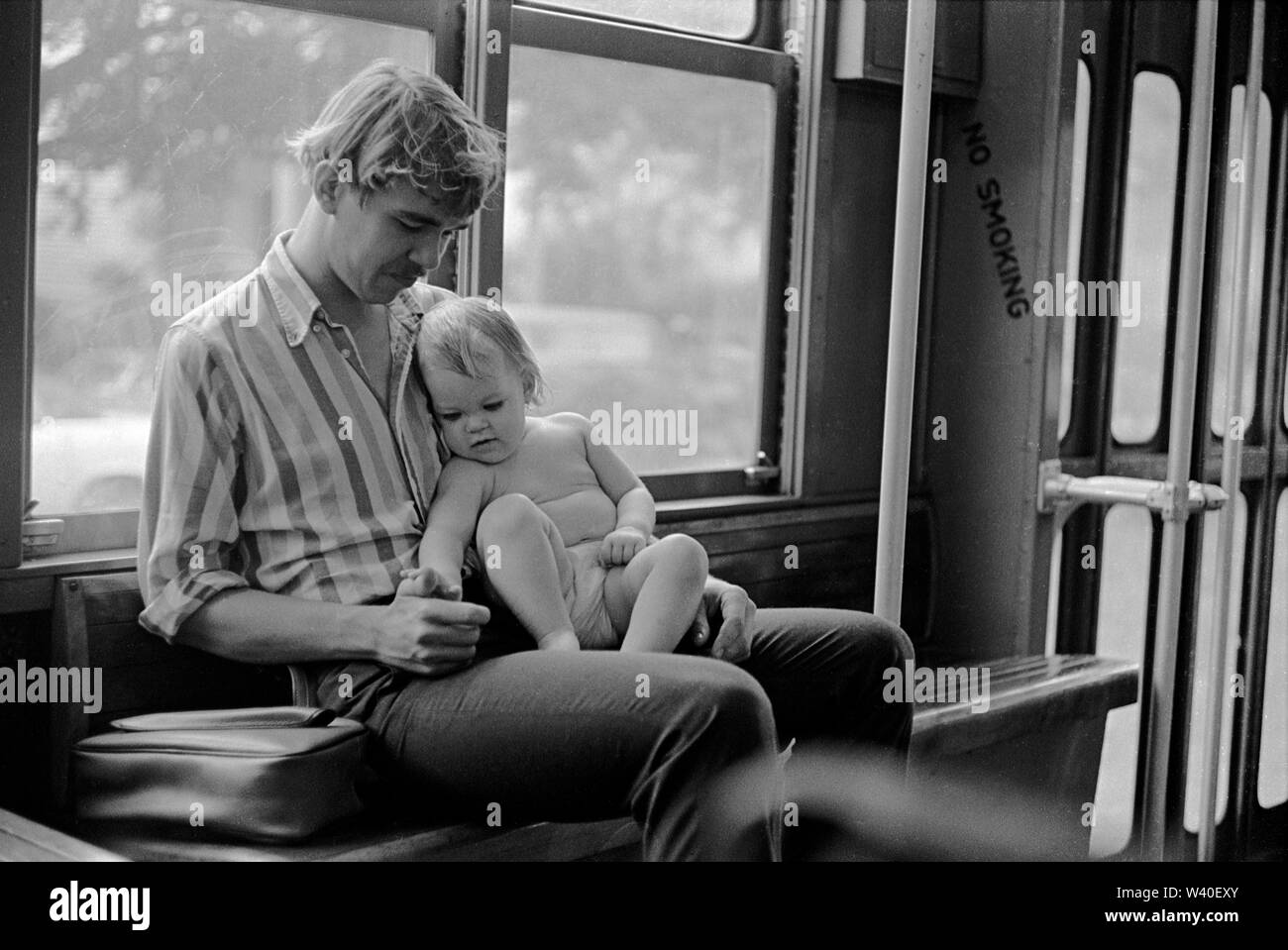 Father and baby child hot and humid weather parent bonding with new baby New Orleans, Louisiana 1969, USA 60s US HOMER SYKES Stock Photo