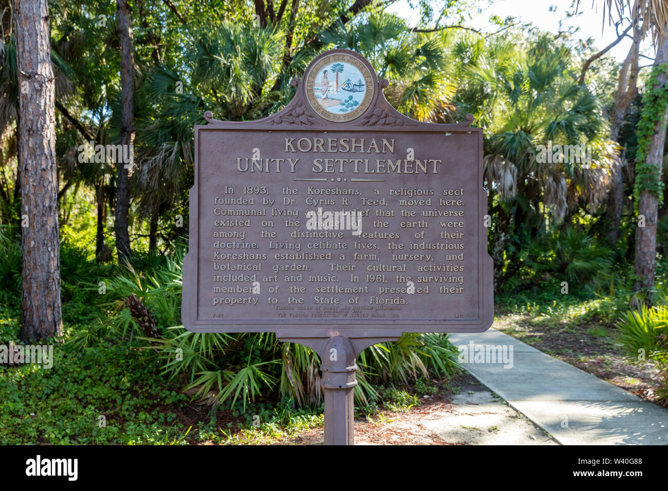 Description marker on the grounds of Koreshan Historic Settlement - a 19th Century Utopian Commune, Estero, Florida, USA Stock Photo