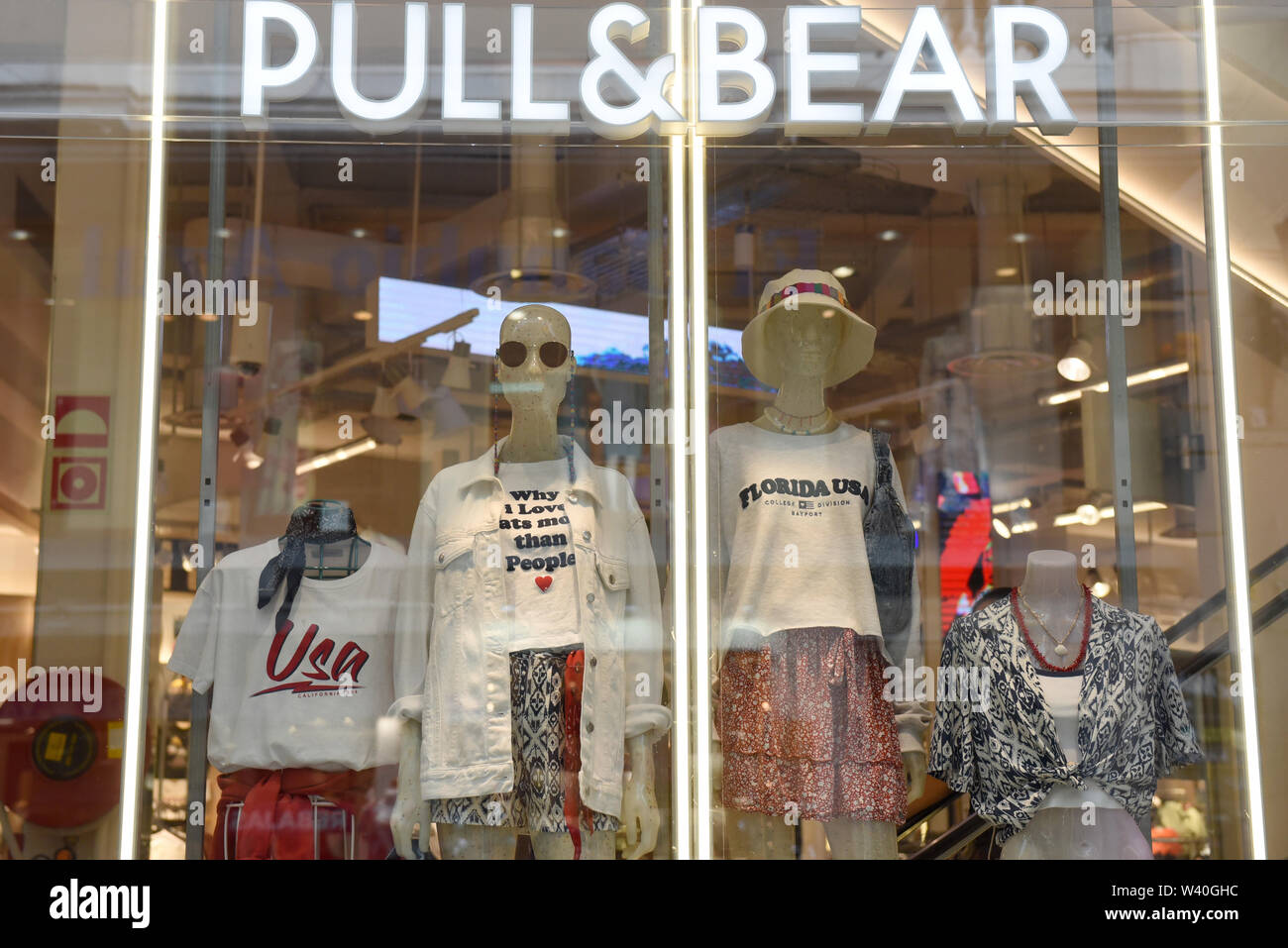 Madrid, Madrid, Spain. 18th July, 2019. Dummies seen through the Pull&Bear  shop window on Preciados Street in Madrid.High street fashion chain Zara  has announced that all of its collections will be made