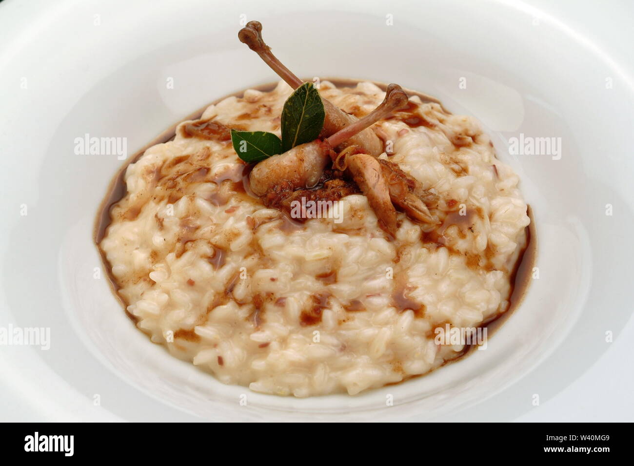 Quail With Rice Italian food recipes, rice with quails Stock Photo - Alamy