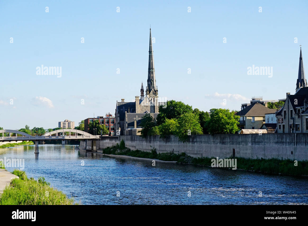 View of Grand River and landmark Main Street Bridge and church near Galt in Cambridge, Ontario, Canada Stock Photo