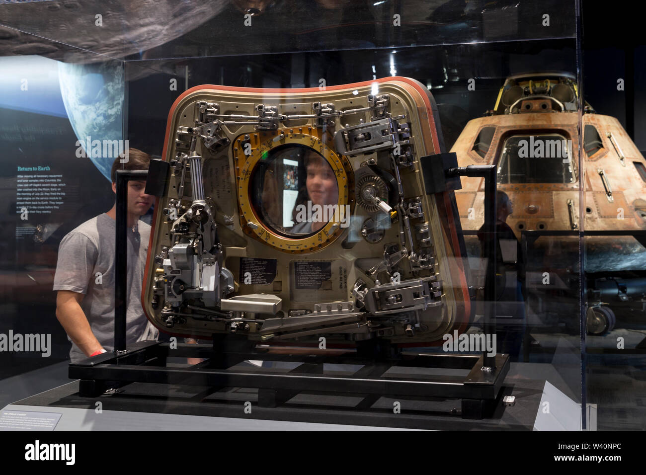 Young Visitors Look Through The Window Of The Unattached Door Of The Command Module Columbia On Display During The Destination Moon Exhibit At The Museum Of Flight In Seattle Washington On July