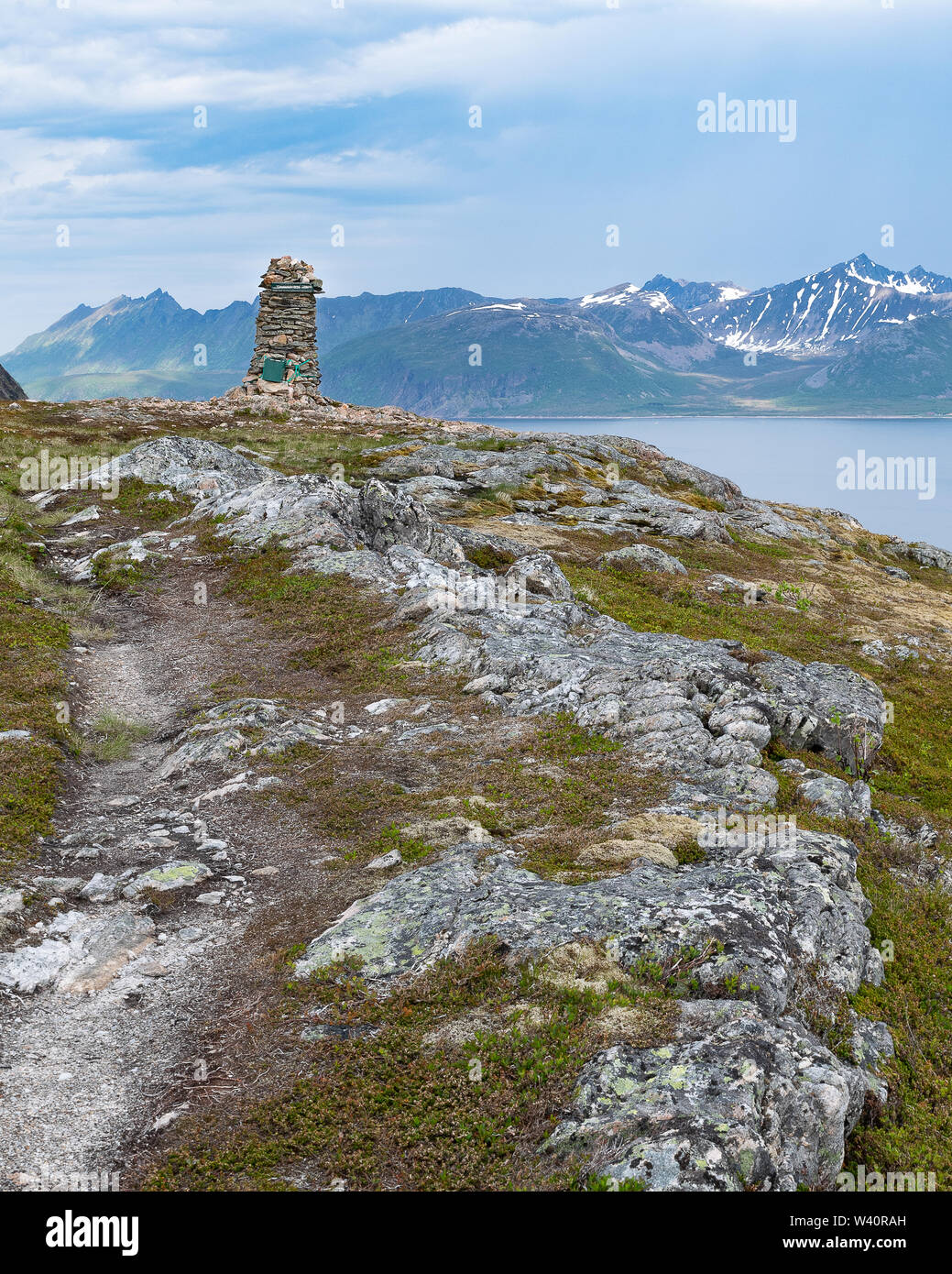 Visitors to the island of Senja in Norway can take a moderate hike to the top of Tonnerten near the town of Rodsandfor amazing mountain views. Stock Photo
