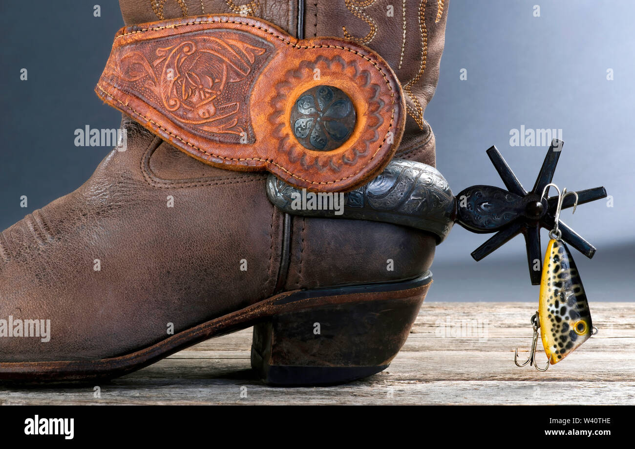 Going cowboy fishing with Mexican spurs and boots. Stock Photo