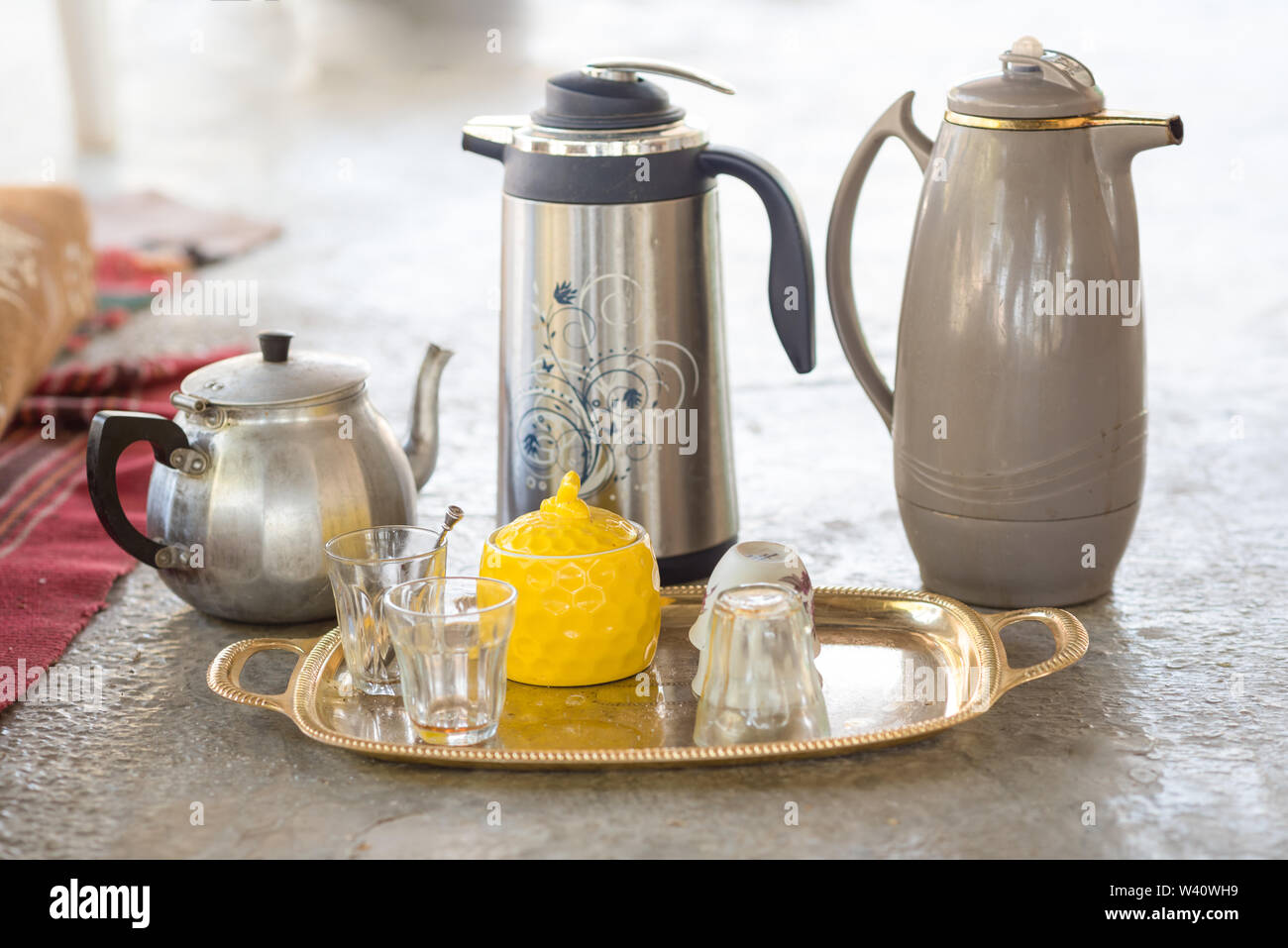 Traditional serving tea and coffee in the Arabs home laying on a tray on the floor in Bedouin or Druze tent during the day for breakfast. Stock Photo