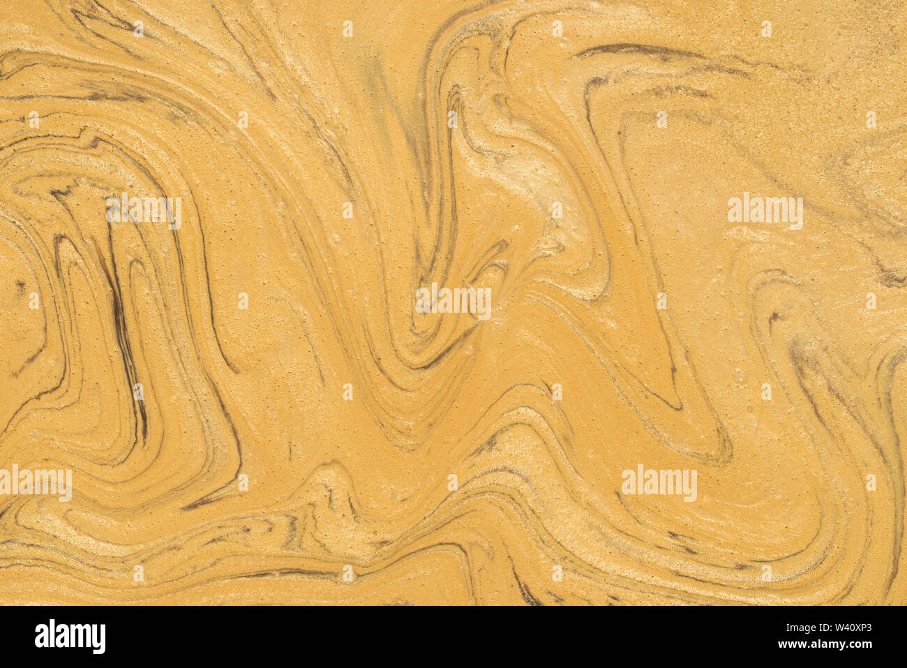 gold color painted marble texture background Stock Photo