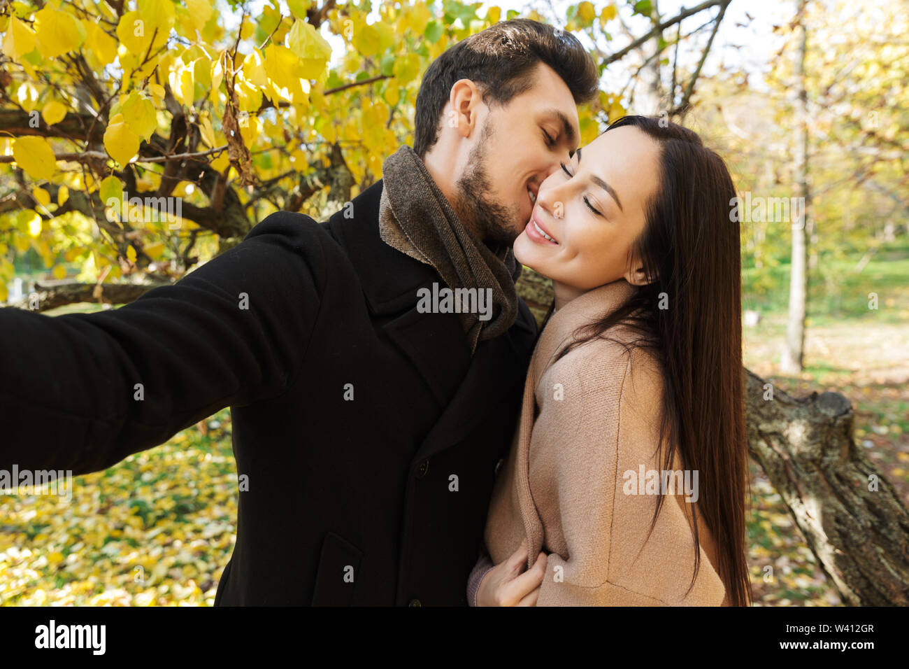 Teenage couple hugging in park hi-res stock photography and images - Alamy