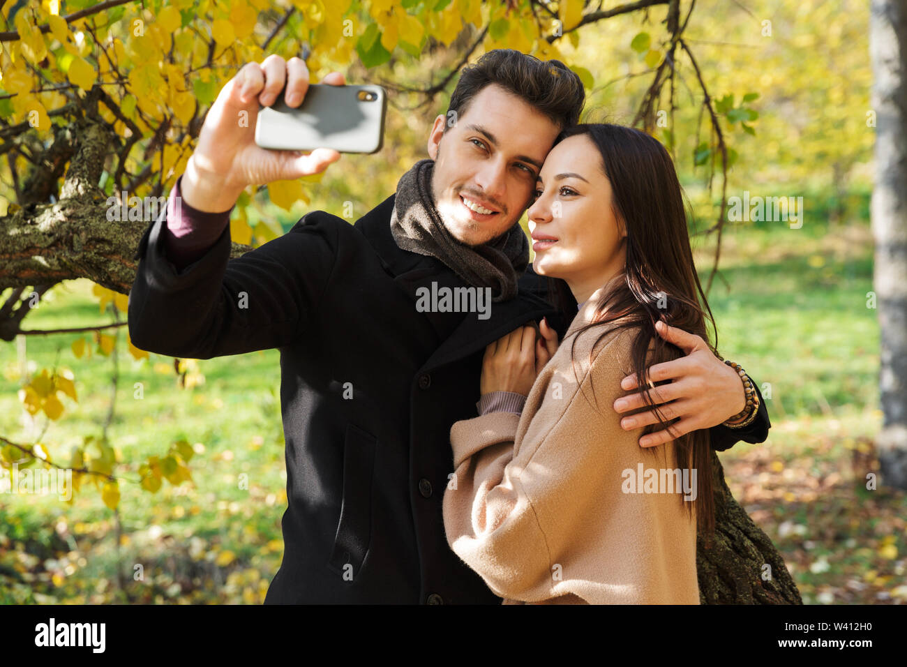 Teenage couple hugging in park hi-res stock photography and images - Alamy