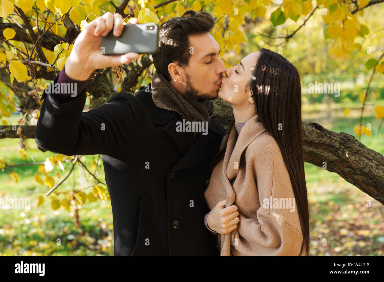Teenage couple hugging in park hi-res stock photography and images - Alamy
