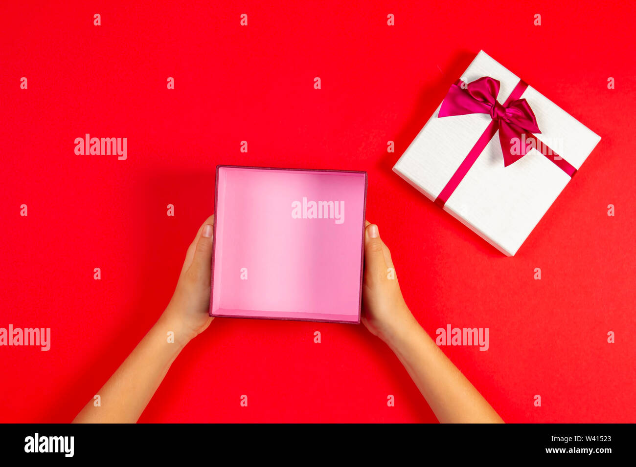 Present box template mock up. Hand open empty present gift box on