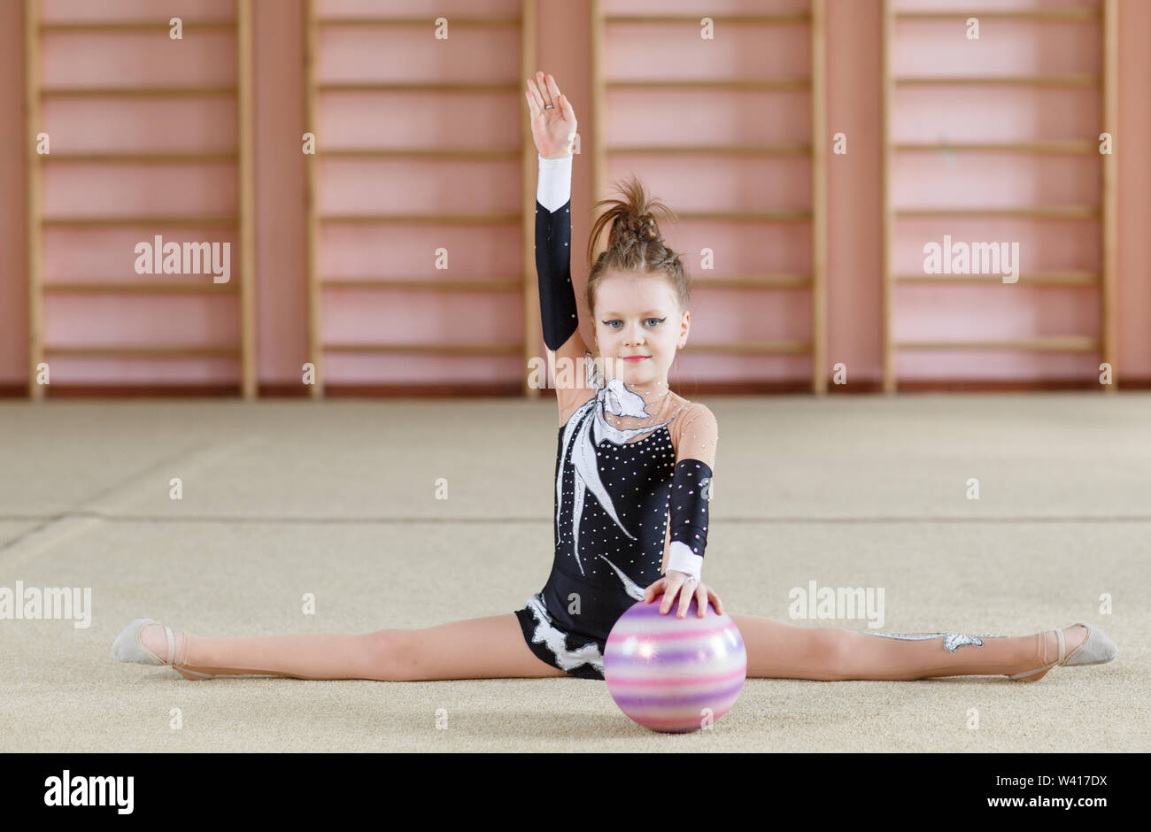 Young girl doing gymnastics in the gym Stock Photo - Alamy