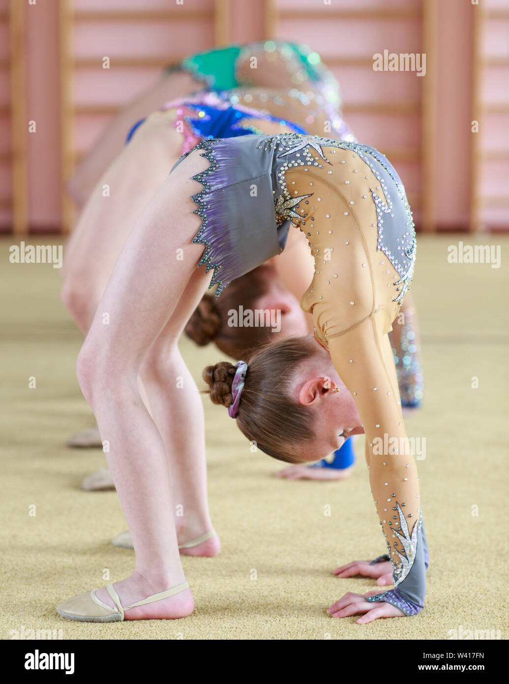 Young girls doing gymnastics in the gym. Stock Photo
