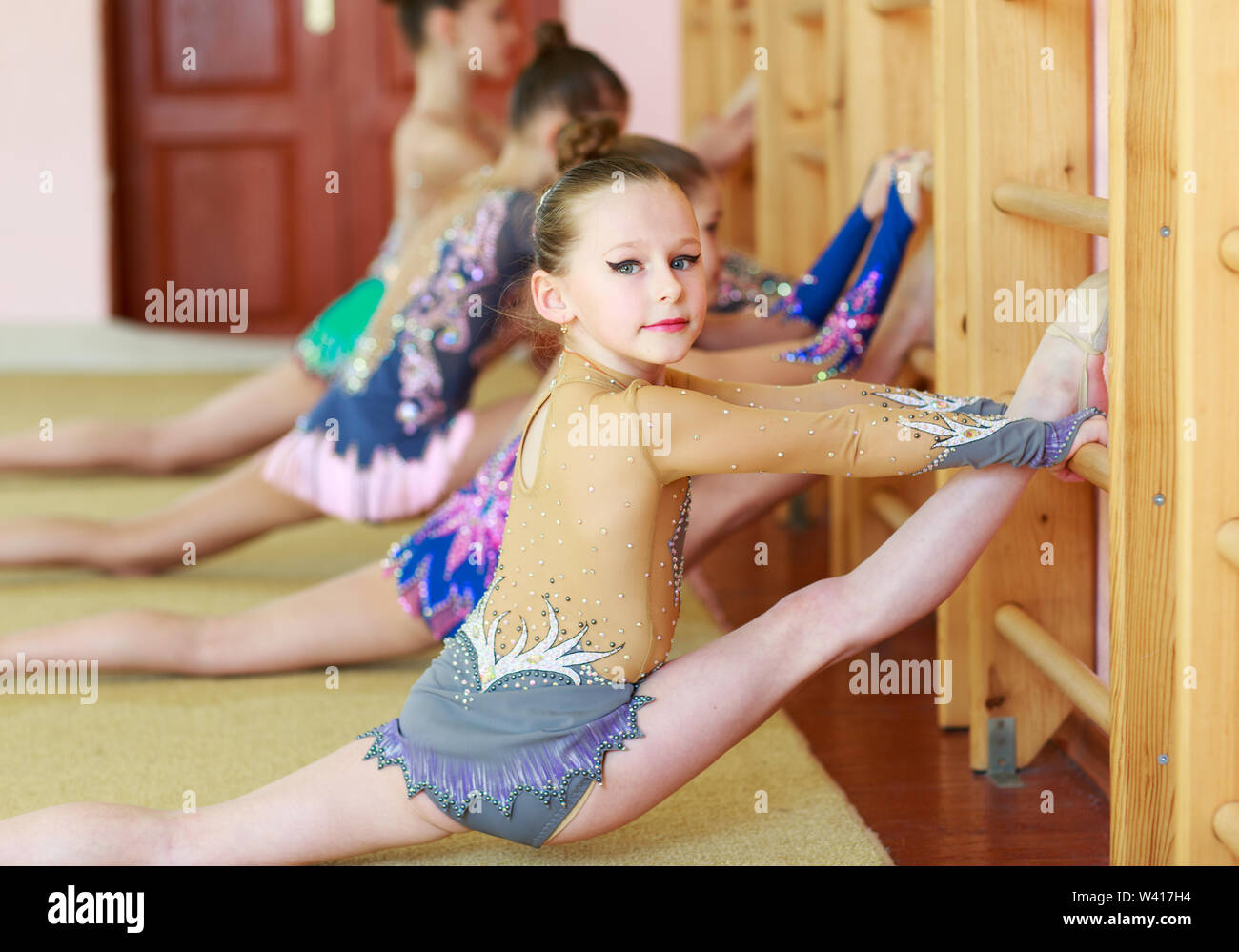 Young girls doing gymnastics in the gym. Stock Photo